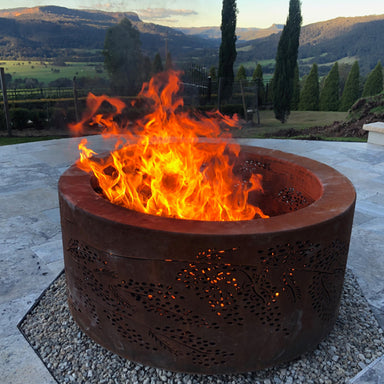 Ironbark Small Double-skin Round Fire pit Outdoor heating Patio decor Garden feature Wood-burning Portable Steel construction Rust-resistant Ash containment Airflow control Cooking grill Heat distribution Safety features Aesthetically pleasing Weather-resistant Easy assembly