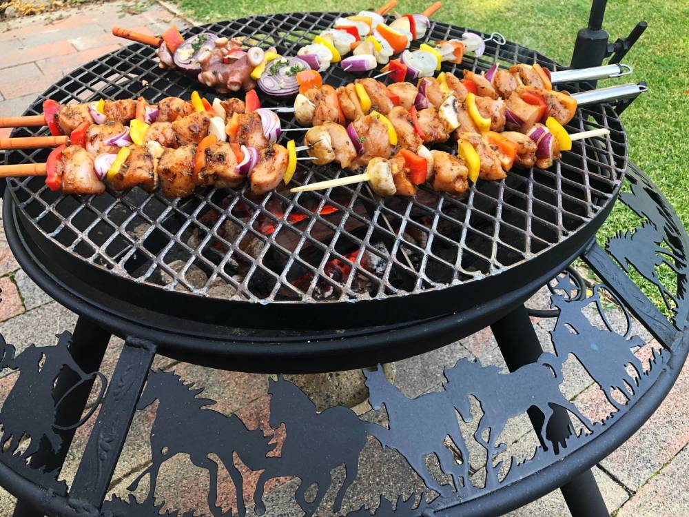 BBQ fire pit Outdoor cooking Wood burning Gas-powered Steel construction Smokeless Portable Adjustable grill grate Ash pan Patio or backyard accessory